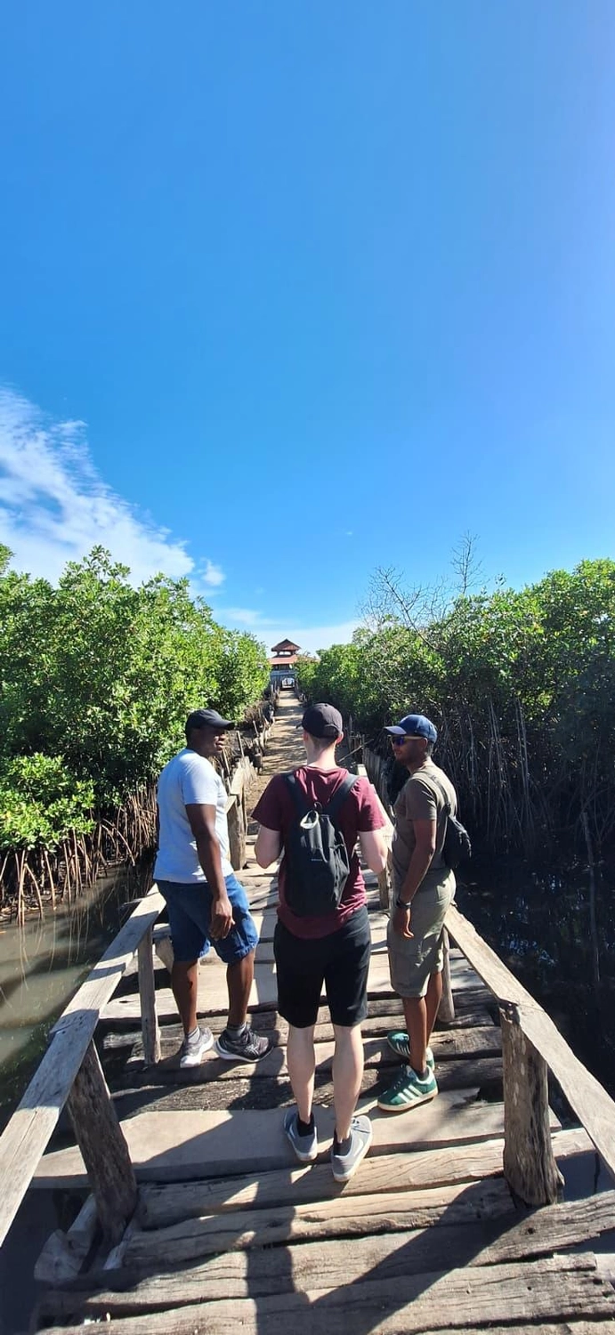 Gambia​ View Tours - Tourism services - Three people standing on Lamin Lodge bridge